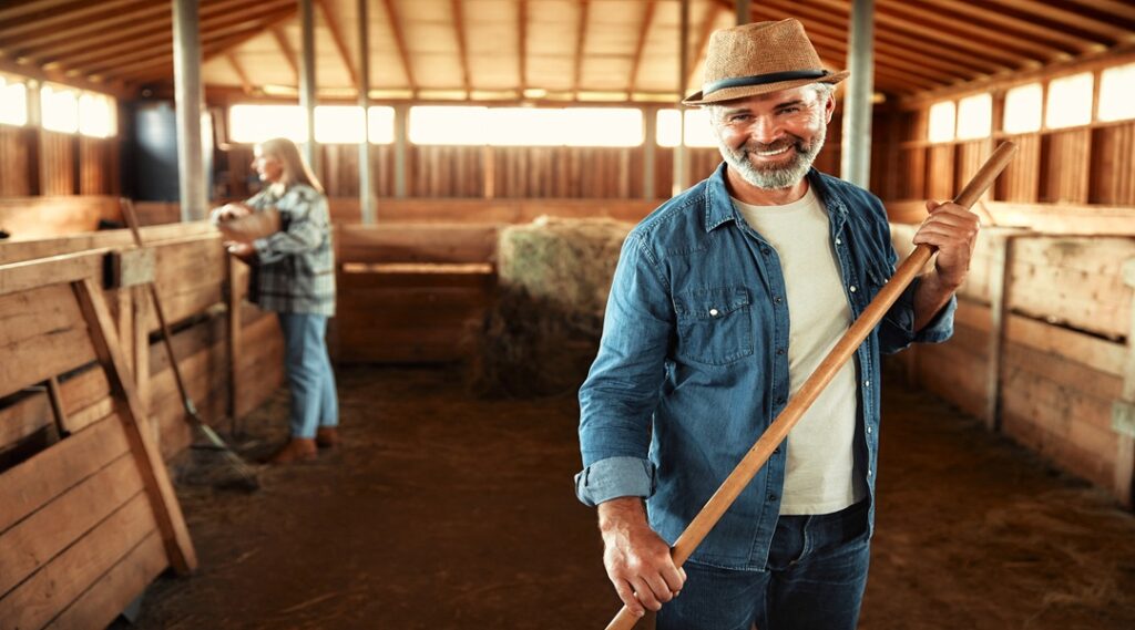 Mature couple working on the farm